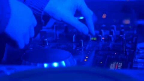 DJ twirls the instruments on the music console Stock Footage 81781964