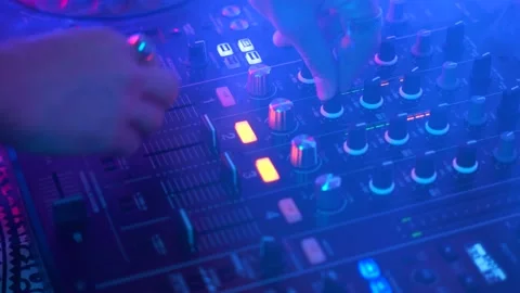 Dj uses Mixing Controller, stroboscopic light and smoke, close up shot 스톡 동영상 152425623