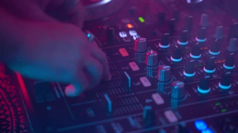 Dj uses professional Mixing Controller,stroboscopic light and smoke, gimbal shot Stock Footage 152425435