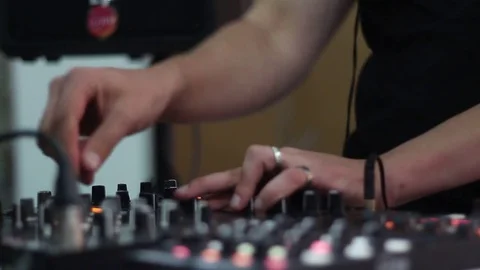DJ using an audio mixer Stock Footage 72705020