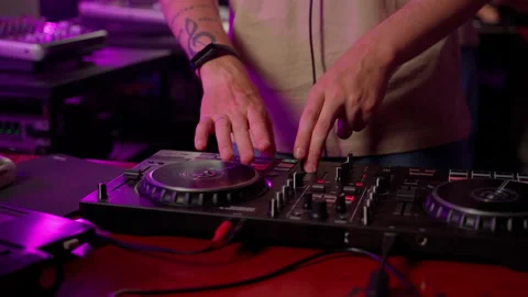 DJ using controller console to mix music list in club close up Stock Footage 201489789