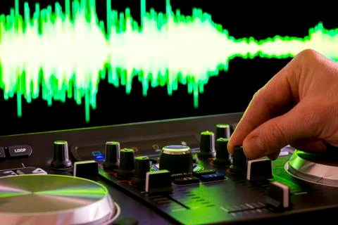 Dj using a dj controller Stock Photos
