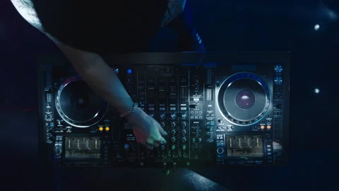 DJ using mixing console at discotheque Video stock 170177976