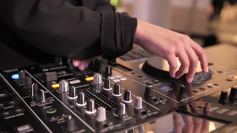 Dj is using a music mixer with editing tools Stock Footage 172145595