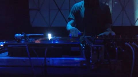 The DJ will scratch the record and works behind the mixer 스톡 동영상 88208388