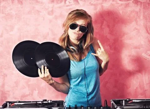 DJ woman, mixer and portrait with vinyl records, sunglasses and horns sign at Stock Photos