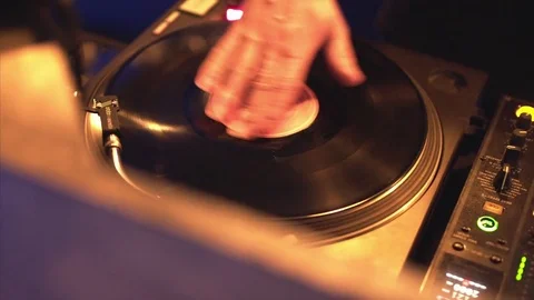 Dj work in club on vinyl, DJ's hands twist the vinyl on party, party in the club Stock Footage