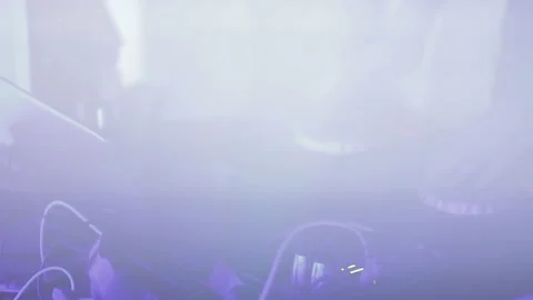 Dj at work. Hands of DJ tweak various track controls on dj's deck Video stock 142898241