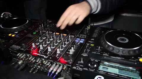 DJ working using a mixer Stock Footage 2887538