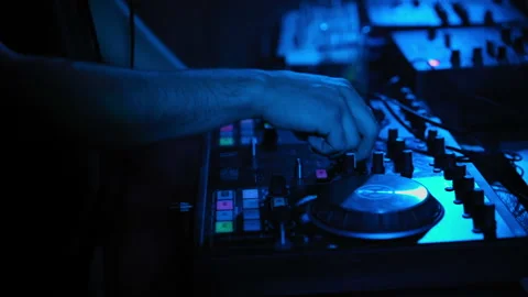 DJ works behind the mixing console Stock-Footage 93344707