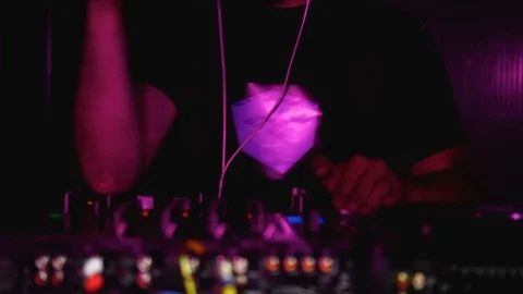 DJ works at a party, dancing at the console Stock Footage 112004258