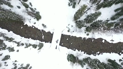 DJI 0001-Going Straight Down looking at bridge with snowmobilers on it 動画素材 137424722