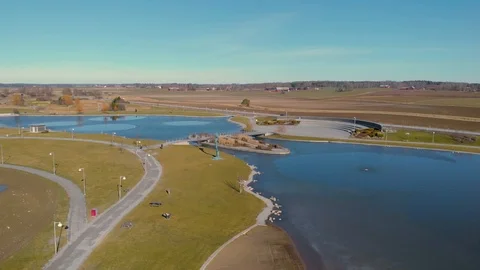 Dji drone flying fast over artificial lake Vídeos de archivo 104373948