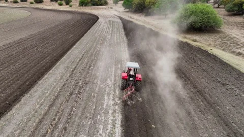 DJI-Drone following Tractor while plowing  動画素材 252818121