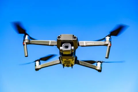 DJI Drone Mavic 2 Pro flying against blue sky Stock Photos