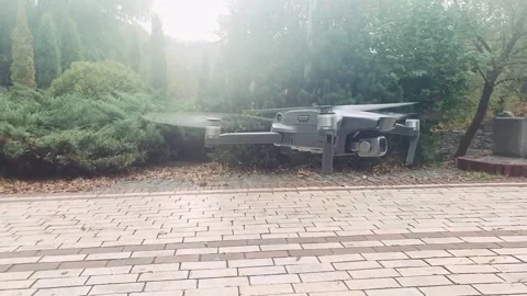 DJI Mavic 2 Pro drone hovers above the ground and flies vertically upwards - 06 Vídeos de archivo 151742490