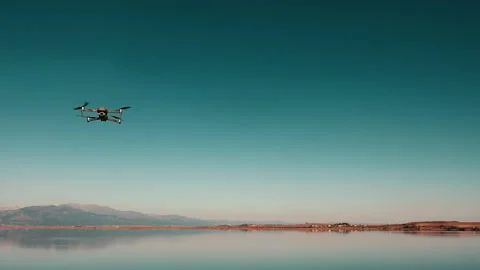 The DJI mavic 2 pro drone flies from left to right Stock Footage 141997796