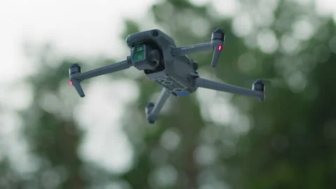 DJI Mavic 3 Cine yaws to the right in front of out of focus background, 6k Stock Footage