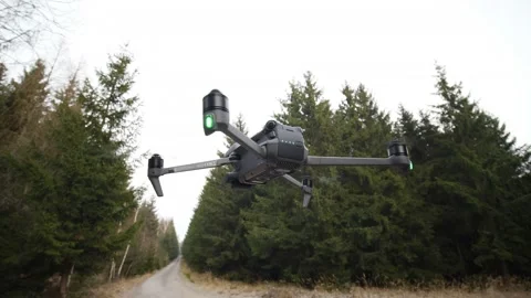DJI Mavic 3 drone hovering closeup orbit in a forest Video stock 167437052
