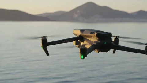 Dji mavic 3 fly, hover over the sea at sunset Video stock 232959625