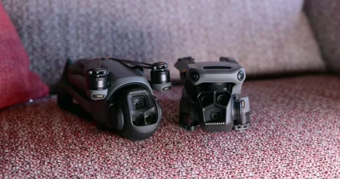 DJI Mavic 3 Pro vs 4 Pro drone camera comparison. Close-up Stock Footage 315520516