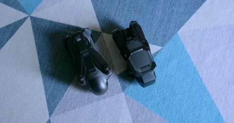 DJI Mavic 3 Pro vs 4 Pro drone comparison.Top-down view, close-up Stock Footage 315521086