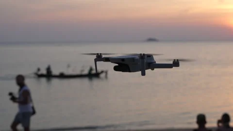 DJI Mavic mini drone hovering in front of nature background Stock Footage 172921234