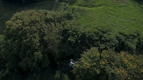 DJI Mavic Pro 2 drone hovering over fields with Phantom flying around it Video stock 103679759