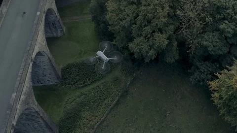 DJI Mavic Pro 2 drone hovering over viaduct with drone flying around it 库存影片 103681670