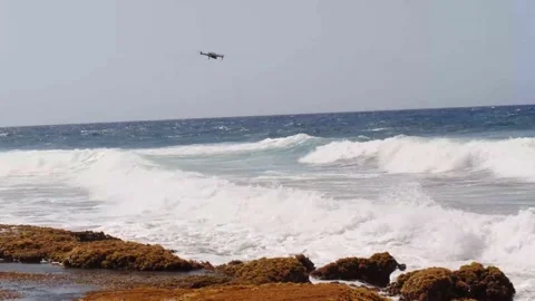 DJI Mavic Pro 2 Drone Flying Over Rocky Wavy Coast Stock Footage 154649956