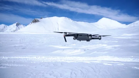 DJI Mavic pro flight in winter, view from the left side. Snowy mountains Stock Footage 125791296