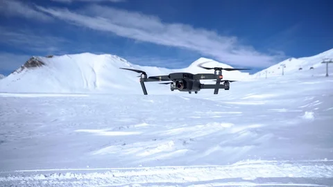 DJI Mavic pro flight in winter, view from the front. Snowy mountains. Gudauri Stock Footage 125791909