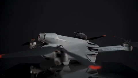 DJI Mini 3 Pro - Unfolded - Spinning Side-On - Fixed Focus - Black Background 動画素材 255208310