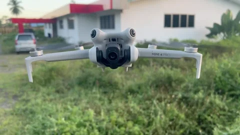DJI Mini 4 Pro Drone Hovering in Flight Stock Footage 273303287