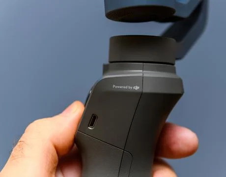 DJI Osmo Stabilizer: Powered by DJI Signage for Android and iPhone Smartphones Stock Photos