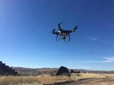DJI Phantom 4 Drone Flying Near US Mexico Border Wall in Arizona Stock Photos