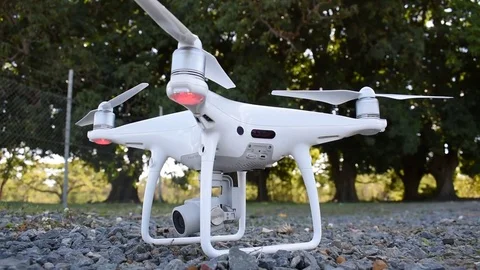 DJI Phantom 4 Pro drone with flashing LED ready to take off Stock Footage 76310246