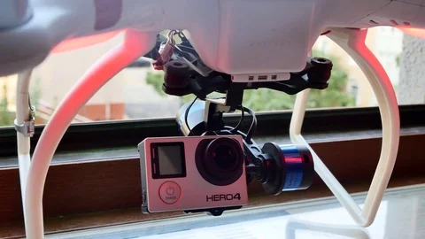 DJI Phantom multicopter with GoPro Hero4 camera on a gimbal mount Stock Footage 80457221