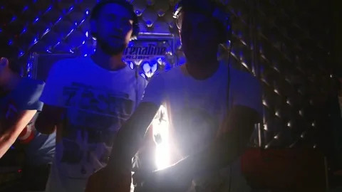 DJs control the mixing desk moving faders and knobs to the disco club in the 스톡 동영상 72215416