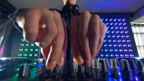 DJs fingers turning small mixer knobs. Video stock 79201891