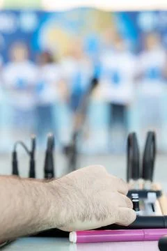 DJ's hand on console at concert outdoors, children graduating Stock Photos