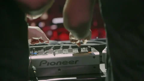 DJ's hands on a console playing at a concert or music festival. 4K Stock Footage 221555134