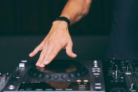 DJ's hands control the remote control close-up Stock Photos