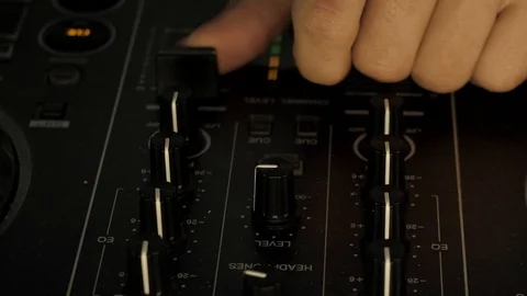 Dj's hands manipulating a mixer at a party 動画素材 108838710