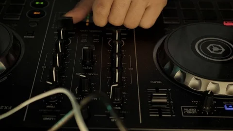 Dj's hands manipulating a mixer at a party Stockbeeldmateriaal 108838912