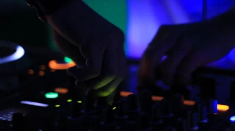 DJ's hands operating sound mixer Stock Footage 40429354