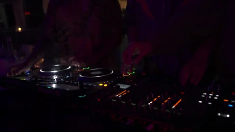 DJs Mixing on Professional Console in Dark Club, Red Neon Light, 4K Vídeos de archivo 329226479