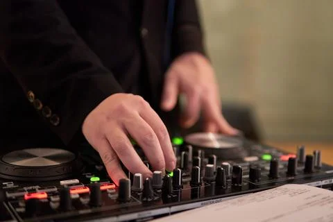 DJs operating the mixer at events Stock Photos