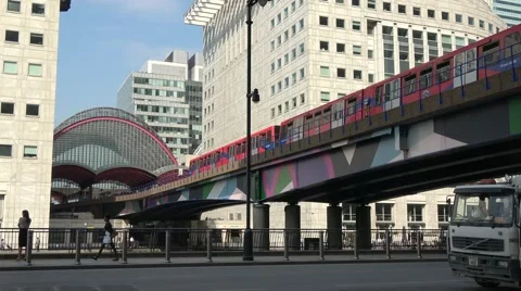 DLR Docklands Light Railway train pulling into Canary Wharf Station Stock Footage 66582257