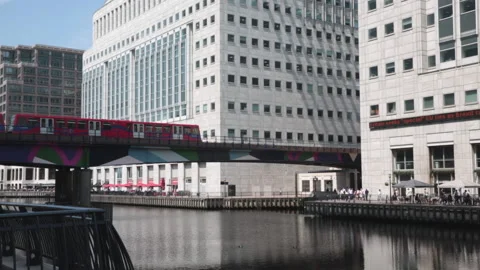 DLR subway train leaving Canary Wharf station Stock Footage 141198663
